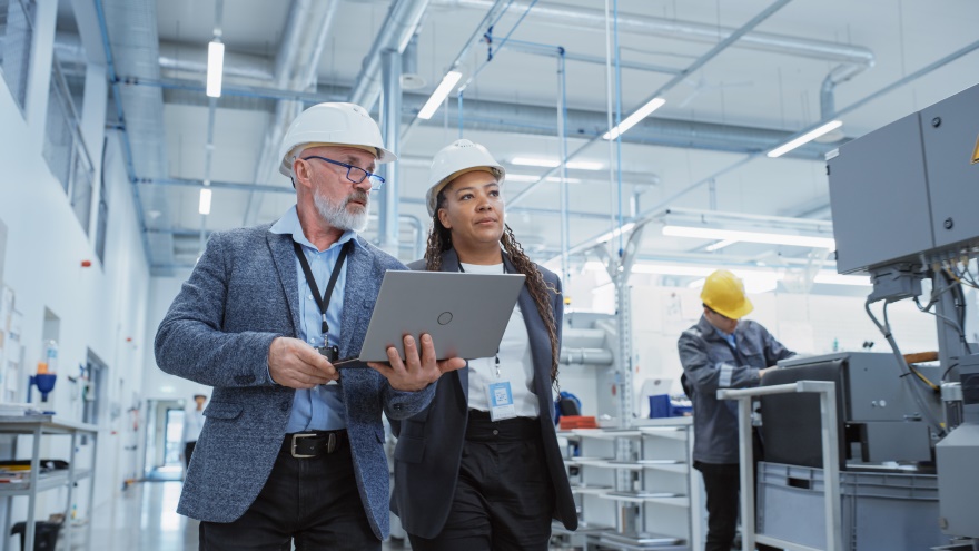 Two people at a job site assessing safety.