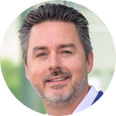 Headshot of James Lumbra.