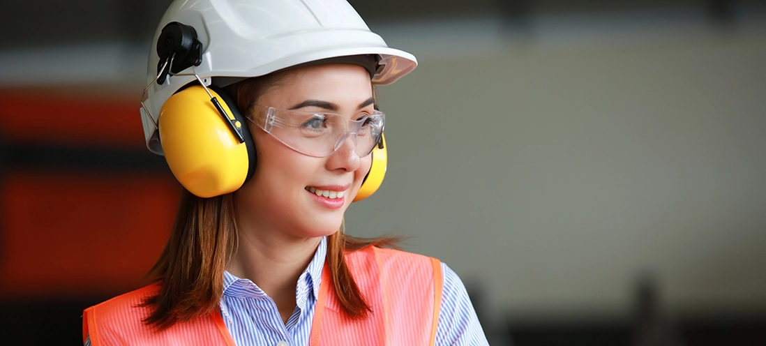 A woman wearing PPE safety gear.